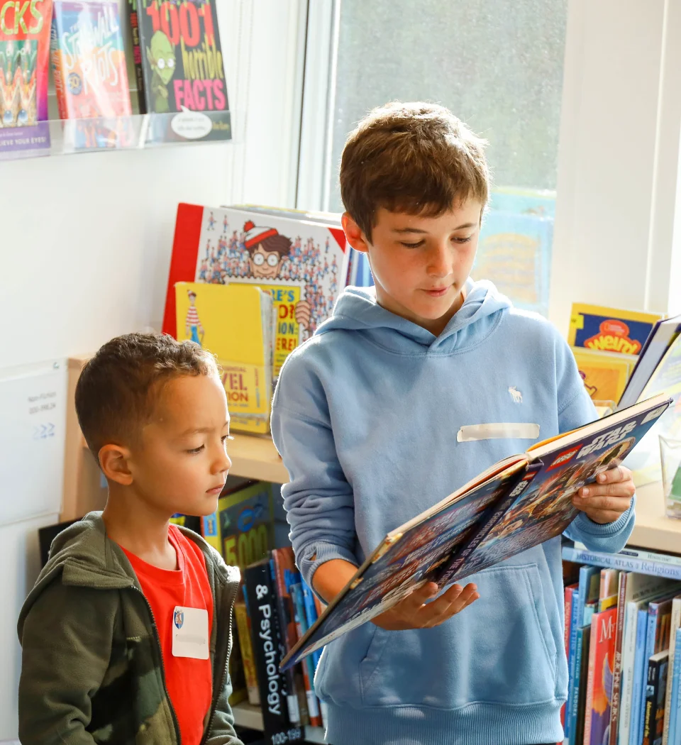 students reading in library