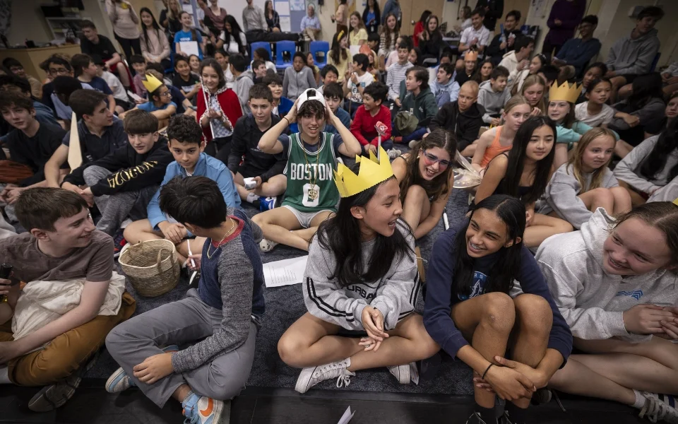 large group of students siting on the floor
