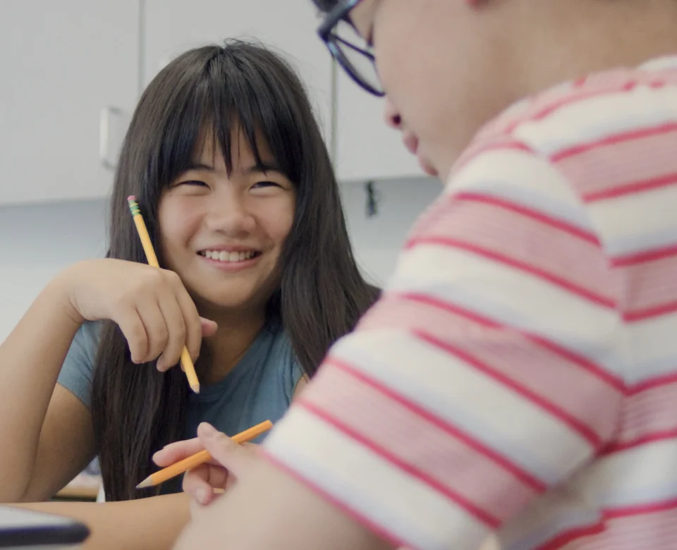 middle school student sitting and speaking