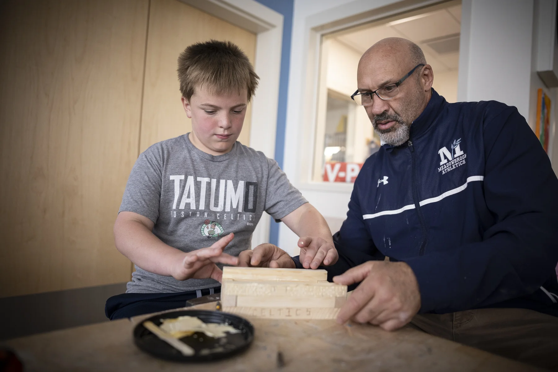 teacher and student in woodshop class
